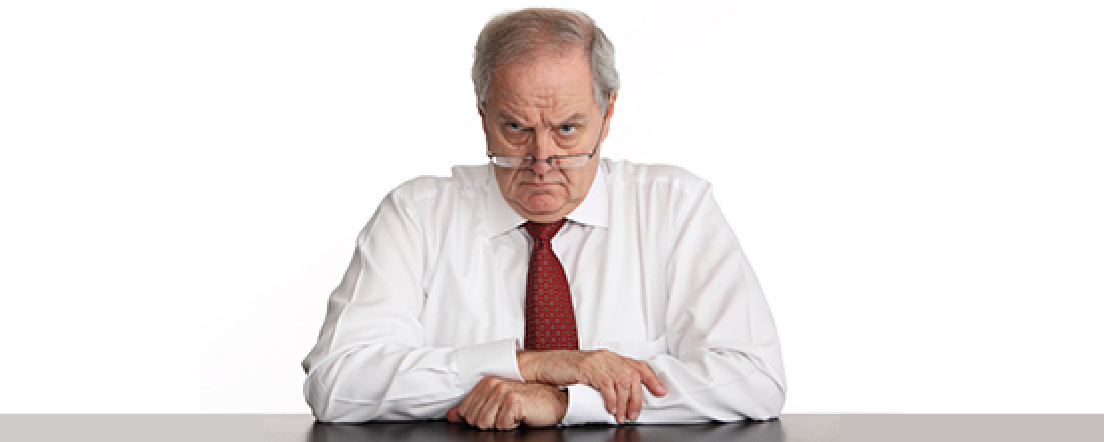 Unhappy man in business clothes staring at you