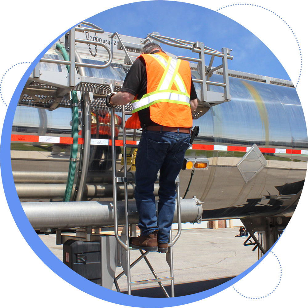 Worker climbing tanker